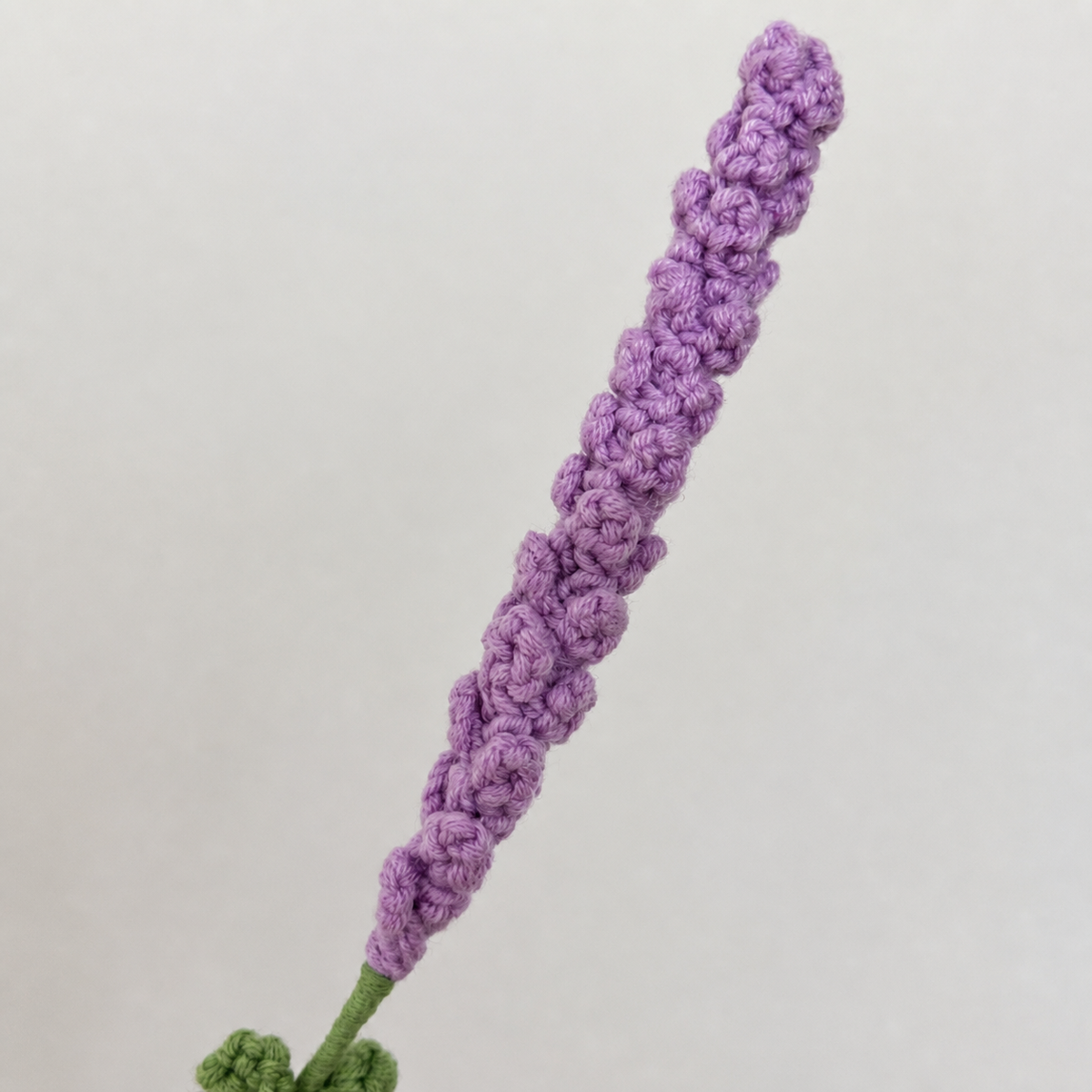 Close-up detail of handmade light purple crochet lavender stitches