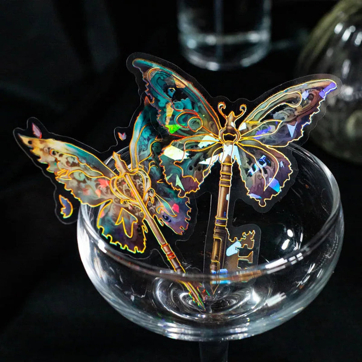 Holographic butterfly stickers decorating a glass