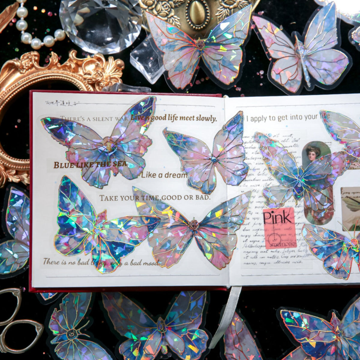 Iridescent butterfly stickers on a journal page