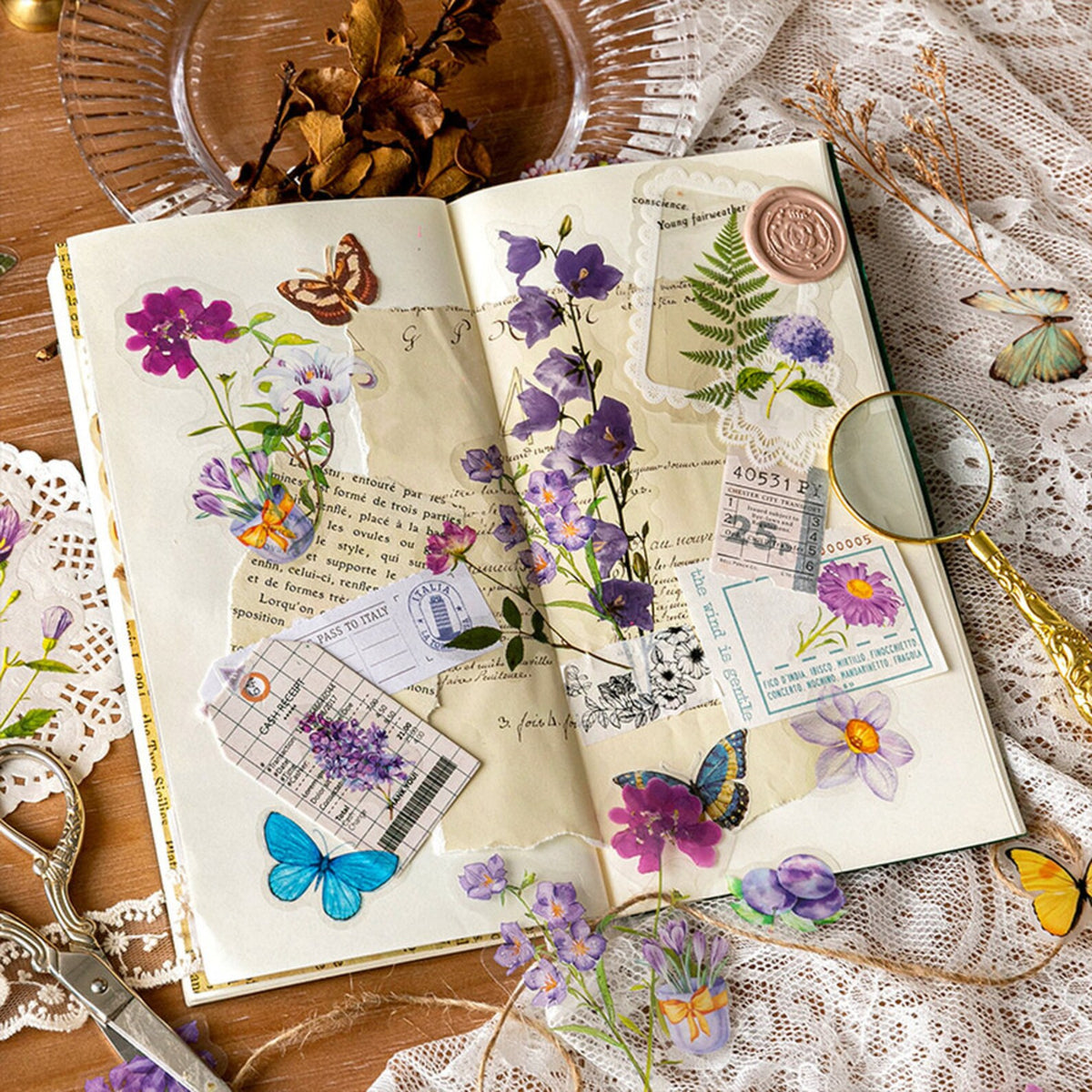 Open journal decorated with vintage botanical PET stickers